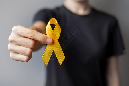 世界癌症日概念的黄丝带健康护理和世界癌症日概念疾病沮丧图片素材