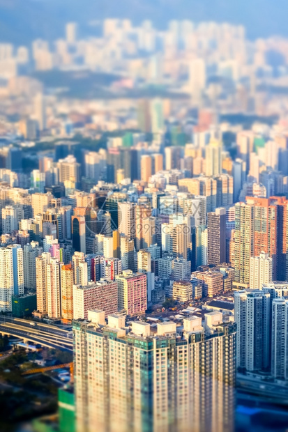建筑学当代的街道具有现摩天大厦的抽象未来城市景色香港空中观视晚间全景倾斜移动效应图片