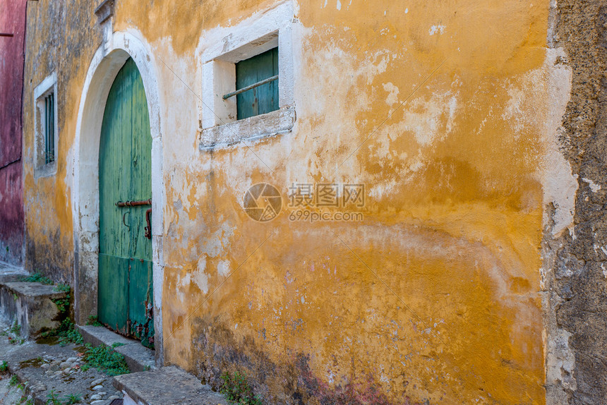 科孚岛西那拉戴斯有石墙的老房子质感砖细节图片