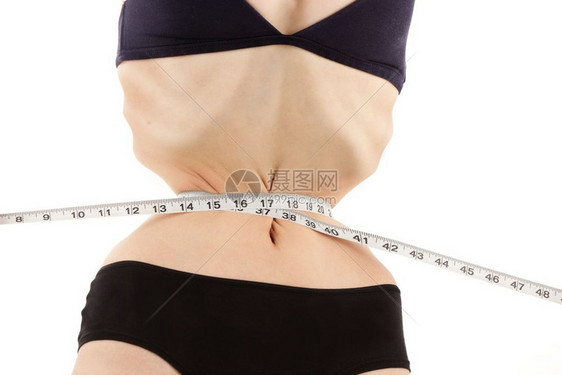 患有阿诺雷斯西亚症的肥胖年轻女正在测量她的瘦身有非常严重的心理健康问题和身体畸形白种落后者常设神经质失去图片