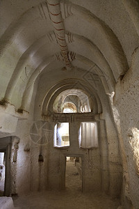 洞穴寺庙卡帕多西亚教堂雕刻在岩石中的头上希腊人卡帕多西亚洞穴教堂雕刻在岩石中山教科文组织粉色的图片