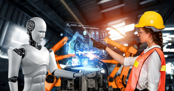 工业的机械化器人与类工在未来厂中协同作业革命和自动化制造过程的人工智能概念机械化工业器人和类工在未来厂中协同作控制论的全息图图片