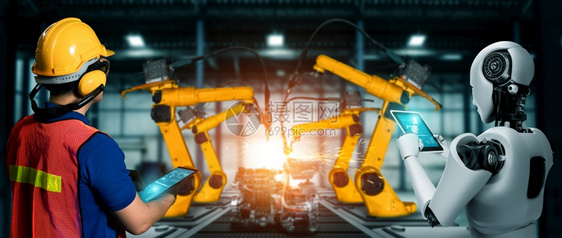 革命仓库机械化工业器人与类工在未来厂中协同作业革命和自动化制造过程的人工智能概念机械化工业器人和类工在未来厂中协同作人造的图片