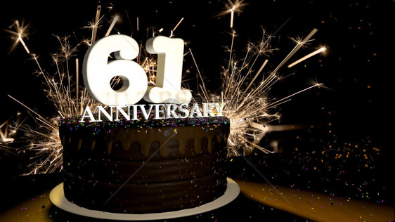 火焰周年纪念61卡圆形巧克力蛋糕装饰着蓝色红黄绿的糖衣杏仁木桌上有白色数字背景是人造火星和彩色糖衣落在桌子上3D插图周年纪念贺卡图片