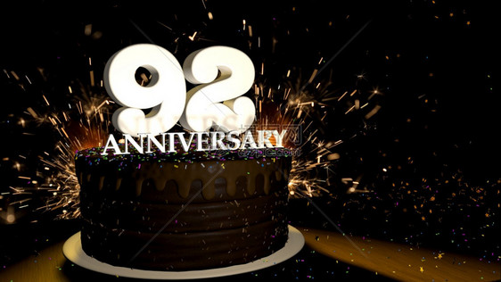 周年纪念92卡圆形巧克力蛋糕装饰着蓝色红黄绿的糖衣杏仁木桌上有白色数字背景是人造火星和彩色糖衣丸落在桌子上3D插图周年纪念贺卡巧图片