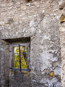 墙希腊科孚岛Pantokrator山旧Perithia的旧废弃石砌房屋Old是希腊科孚岛北侧的一座鬼村窗户视图片