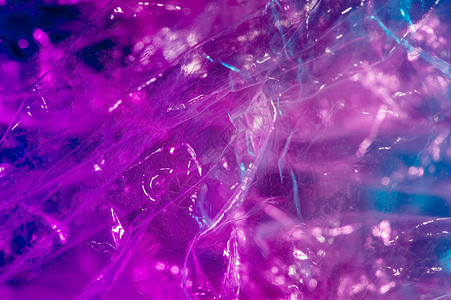 抽象的大众超现实主义荧光的809年代风格的抽象时尚全息背景亮酸色皱褶玻璃纸薄膜的真实质感SynthwaveVaporwavewe图片