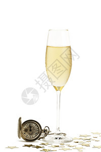 假期古董斯塔克冷杯香槟配上旧怀表和星冷杯香槟配上旧怀表和白色背景上的金属星图片