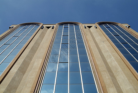 办公楼的表面面建筑学玻璃石头窗户建筑反射天空蓝色图片