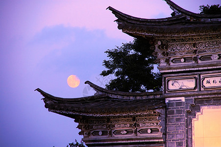 古中国建筑结构历史棕褐色月亮天空古董屋顶背景图片
