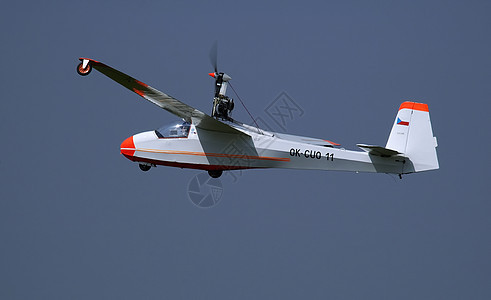 极光航班飞机橙子飞行白色航展背景图片