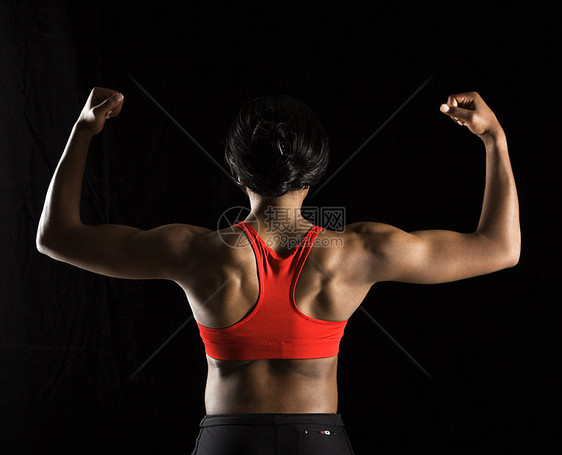 坚强的女人活力运动员二头肌身体素质成人双臂水平衣服训练运动图片