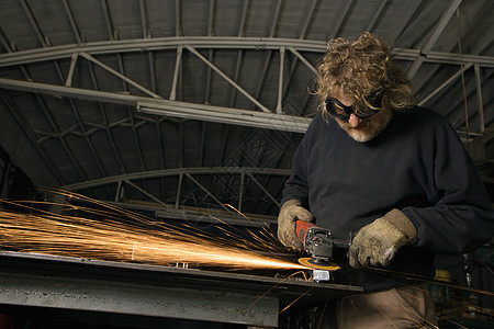 铁匠制造火花手套作坊贸易职业五金运动水平加工硼砂男人图片