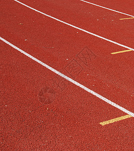 轨道和字段竞赛运动古铜色跑步红色竞争白色勋章金子火车图片