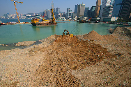 香港海滨建筑公司港口地面地方泥船海军天际工人起重机卵石挖掘机图片