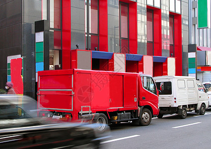 城市交通流量红色人群商业运输市中心店铺运动车辆速度建筑图片