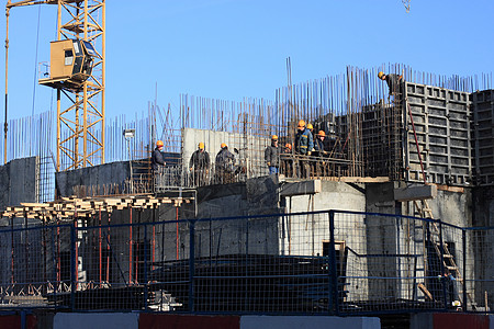 住房大楼城市商业房地产天空团体房子起重机工人建设者背景图片