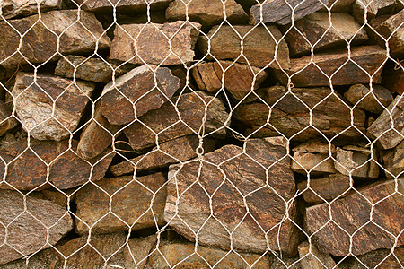 石墙格栅受保护棕色栅栏石头技术纹理监狱团体城市背景图片