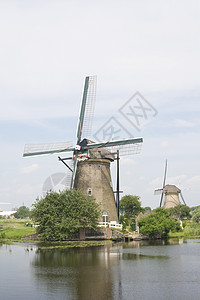 荷兰风车和运河堤防旅行旅游农业小孩图片