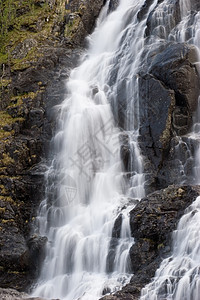 挪威的瀑布石头岩石白色山脉旅行背景图片