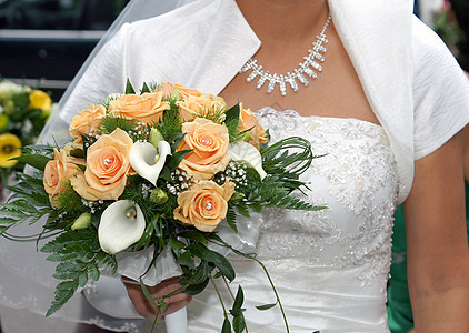 花束玫瑰婚礼新娘庆祝插花捧花中年人女性成年人衣服婚纱图片