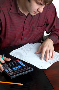 在职会计师经理男人信用商业办公室合同贷款销售量工人计算器图片