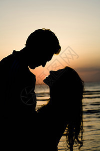 亲吻夫妇嘴唇太阳女士黑色海洋男人橙子夫妻图片