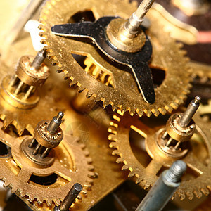时间装置宏观齿轮车轮手表链轮发条机器旋转乐器金子图片