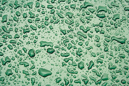 钢板表面的水滴薄雾珠子凝结水分雨水宏观圆形雨滴绿色飞沫图片