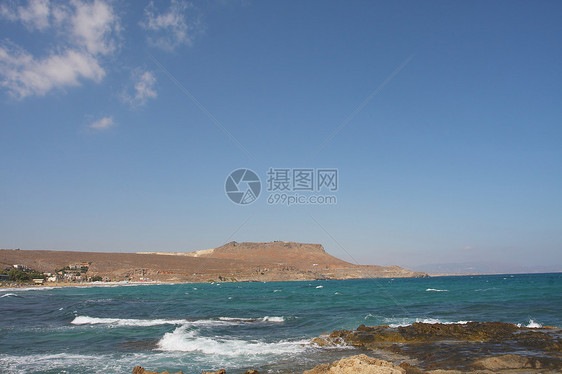 海滩视图太阳海岸线土地天空蓝色岩石山脉旅行闲暇热带图片