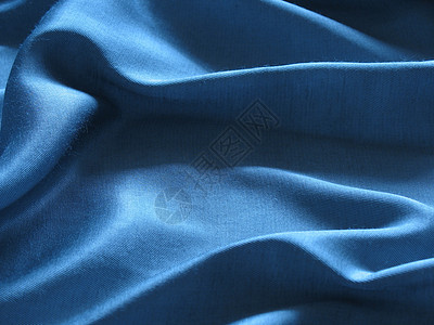 蓝丝绸背景摘要蓝色曲线柔软度纺织品材料折叠图片