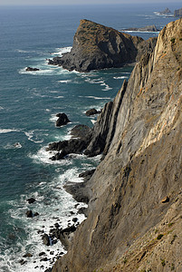 悬崖日出反射蓝色国家日落场景海滩岩石娱乐旅行图片