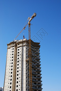 正在建造的建筑房起重机窗户公寓活动机械摩天大楼吊装城市场景天空背景图片