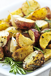 烤土豆黄色食物食品蔬菜油炸服务盘子草药驻扎楔子图片