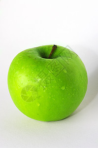 白色背景上的绿苹果美食绿色小吃水果美丽甜点食物果汁圆圈图片