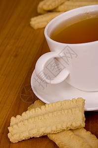 茶杯和饼干盘子杯子甜点补品桌子陶瓷早餐面包木头小吃图片