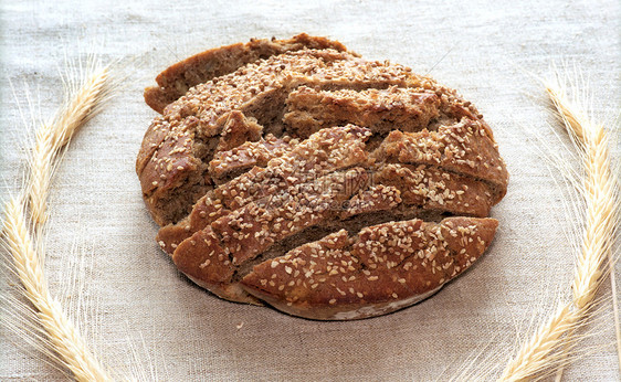 黑麦面包卷帆布烹饪面包棕色种子尖刺食物美食烘烤芝麻图片