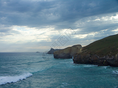 新西兰海岸沿岸线波浪海洋太阳海浪环境露头射线岩石场景旅行图片