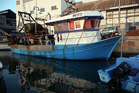 渔船海洋城市钓鱼日落石头运输雅法海岸海港漂浮图片
