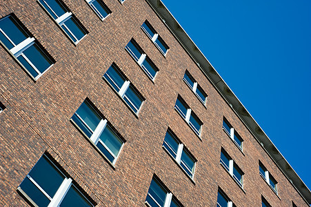 砖砖办公大楼高楼红色棕色天空公司职场建筑学办公室房地产窗户图片