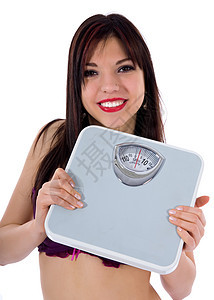 白色背景上有天秤的漂亮女孩运动损失平衡重量营养肥胖女孩图片