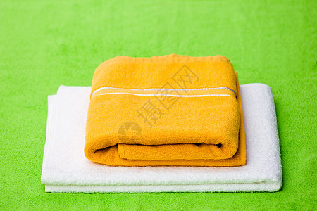 毛巾黄色绿色家居用品折叠面巾棉布织物图片
