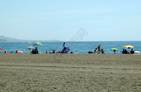 海滩沐浴者旅游天空洗澡酷暑热带波浪海洋假期太阳背景图片