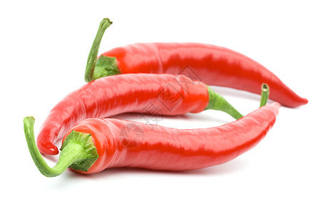 三只红辣椒红色辣椒白色水果食物香料活力宏观蔬菜绿色图片