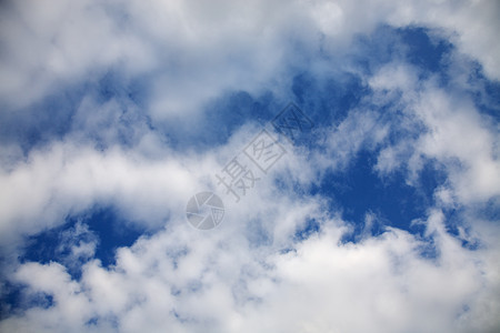 云环境白色蓝色飞行天空阳光衰退景观日光图片