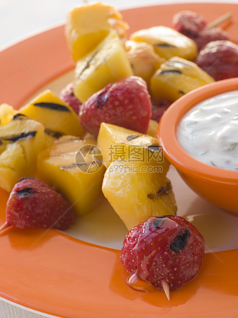 含蜜糖的焦融水果布罗谢特菠萝食物热带食谱厨艺蜂蜜焦糖奶制品食品甜食图片