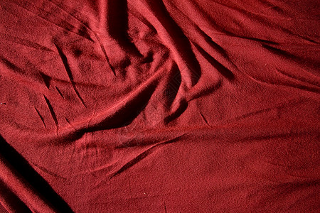 红衣纹理床单被单棉布皮棉织物衣服材料纺织品皱纹折痕图片
