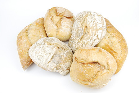 一群新鲜的自制白面包早餐硬皮食物圆形种子白色谷物棕色圆圈小麦图片