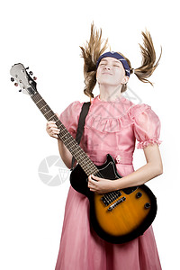 带着摇滚吉他玩头牌音乐的年轻女孩图片