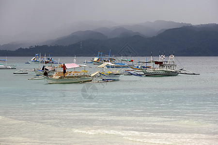 海上船只假期旅行渔夫海浪呼吸管海岸线蓝色海滨娱乐海洋图片